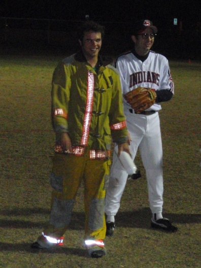 players costumed as a fire fighter and baseball player